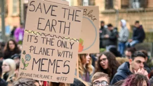 When Memes Became More Famous Than Movies 3 People Protesting Holding A Cardboard Where Save The Earth,It'S The Only Planet With Memes Written On That